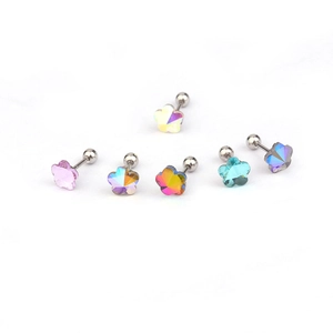 Detail of six flower-shaped screw-back studs with colorful crystals and metal posts