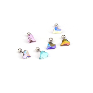 Detail of six heart-shaped colorful zircon screw back earrings in various vibrant colors
