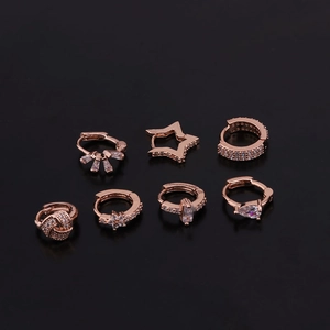 Rose gold heart and star cubic zirconia hoop earring set on black background