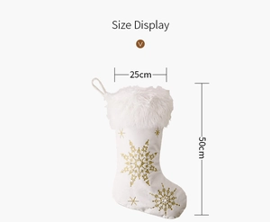 Detailed view of white velvet Christmas stocking with gold sequins and size dimensions