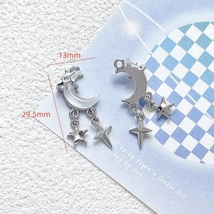 Macro detail of silver moon and star pendant with 13mm by 29.5mm dimensions