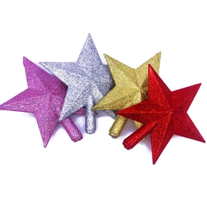 Glittering Christmas tree star toppers in gold silver red and purple on white background