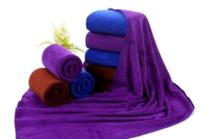 Detailed texture of thick absorbent microfiber towels in various colors for car cleaning