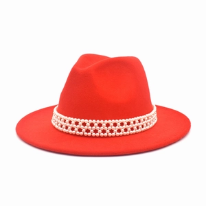Detailed view of red wool fedora hat featuring a mesh pearl decorative headband