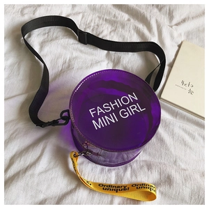 Macro view of purple transparent PVC round bag with Fashion Mini Girl print and strap