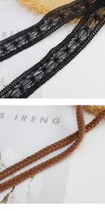 Close-up of black floral lace ribbon and brown braided rope belt details for dresses