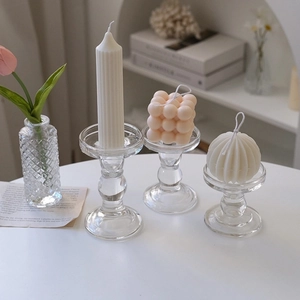 Elegant set of three crystal glass candle holders in varied heights for luxury table decor