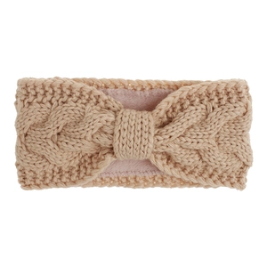 Detail of cable knit headband with warm fleece lining and elegant bow design