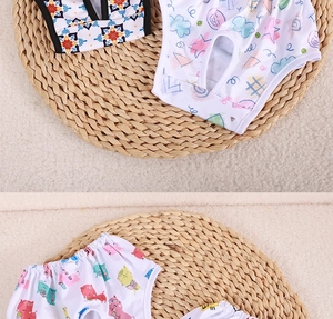 Detail of printed dog diapers with elastic waistbands and tail holes for pet hygiene