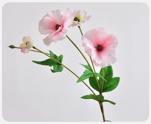 Close-up of pink butterfly ranunculus artificial flower with detailed silk petals and buds