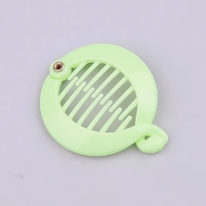 Detail view of mint green round banana hair clip showing inner comb teeth and locking clasp