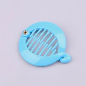 Detail view of light blue plastic banana clip with round comb teeth and metal rivet