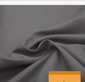 Close-up of the dark grey washed cotton fabric with soft texture and fine weave