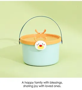 Detail of light blue wedding favor candy bucket with orange reindeer lid and handle