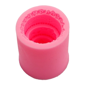 Cylindrical pink silicone mold with detailed lace texture for DIY candles and cakes