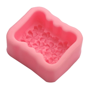 Pink silicone flower mold with detailed floral texture for soap and candle making
