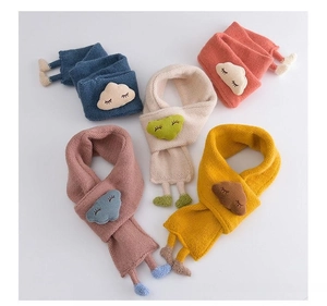 Detail of soft knitted baby scarves with plush cloud embroidery and knit foot accents