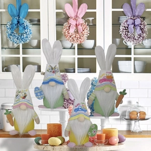 Detail of plush Easter gnomes with bunny ears and bead wreaths on a tiered tray