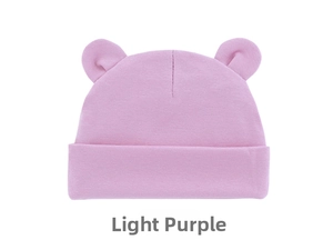 Detail of light purple baby knit hat with cute bear ears on plain white background