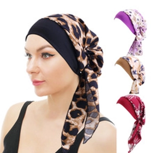 Detail showcasing variety of leopard print and floral twisted turbans for women