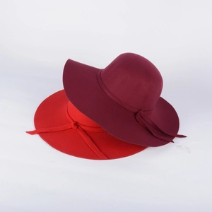 Detailed close-up showing the wool felt texture and elegant bow on wide brim hats