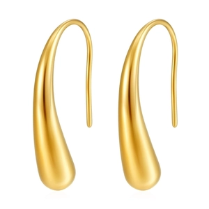 Macro shot of polished gold water drop earrings showing a smooth metallic surface