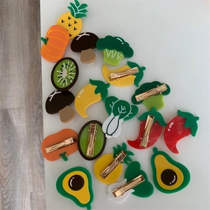 Assorted fruit and vegetable acetate hair clips including broccoli pumpkin and avocado