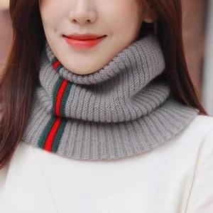 Women's grey knitted turtleneck scarf with stylish red and green stripe detail