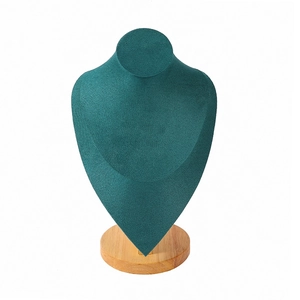 Elegant dark green velvet bust necklace stand with natural wooden base for jewelry display