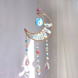 Handmade gold moon suncatcher with blue evil eye beads and crystal rainbow prisms