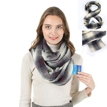 Detail of plaid faux cashmere neck gaiter with pocket for hands and phone