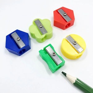 Mini plastic pencil sharpeners in various shapes and colors including red blue and green