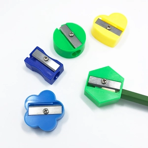 Mini colorful manual pencil sharpeners in various shapes like heart and flower designs