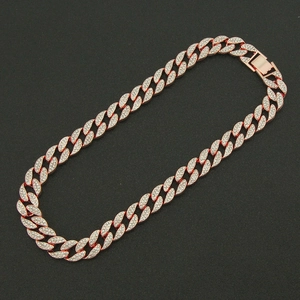 Macro shot of rose gold hiphop Cuban chain necklace with sparkling full diamond inlay