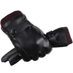 Detail of black PU leather gloves with burgundy knit cuffs and decorative buckle strap