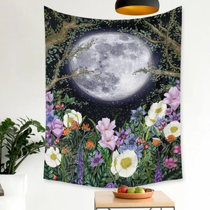 Detail of bohemian moon phase tapestry with colorful wildflowers on white wall decor