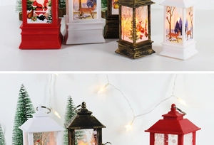 Detail of festive Christmas lantern with Santa Claus scene and warm LED light glow