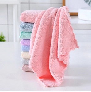 Detailed stack of colorful coral fleece bear-shaped towels with soft texture