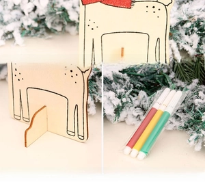 Detailed view of DIY wooden Christmas reindeer craft kit with markers and base