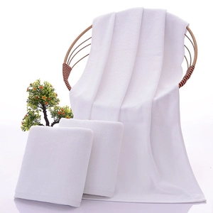 White high-quality 100% cotton hotel towel set with bath towel and face cloth on chair