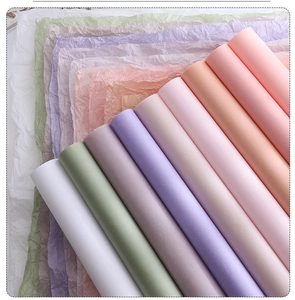 Detailed texture view of smooth and wrinkled colorful silk tissue paper for gift wrapping