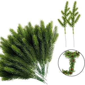 Artificial pine needles for Christmas home decor and DIY crafts with red berries