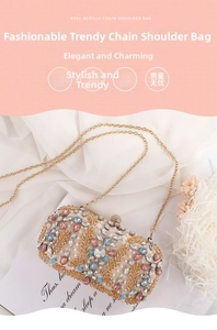 Detail of oval evening bag with crystals, gold leaf embroidery, and ball clasp on silk