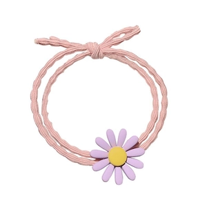 Pink elastic hair tie with a purple daisy flower ornament on a clean white background