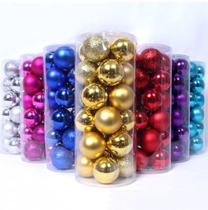 Detailed view of colorful 6cm Christmas ball ornaments in clear cylinder packaging