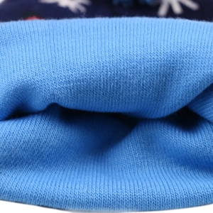 Blue Christmas knit hat with reindeer and LED lights, close-up of internal texture