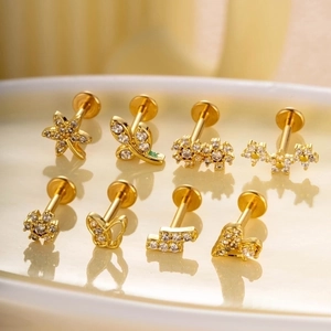 Detailed set of 8 gold stainless steel labret studs with butterfly and flower crystal tops