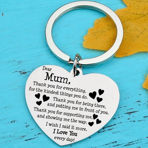 Stainless steel heart keychain for Mum with engraved poem on blue wood background