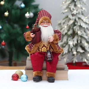 Detail of sitting Santa figurine in red and brown plaid attire with vintage lantern