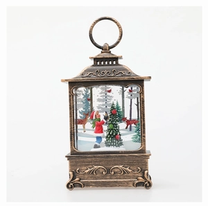 Detail of vintage bronze Christmas lantern with forest scene and hanging ring